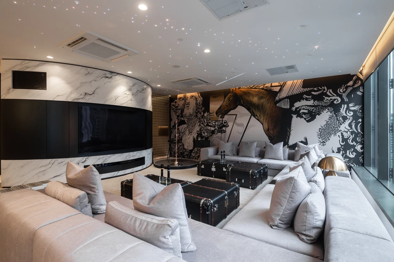 The main lounge establishes hospitality scale and the horse mural in context.