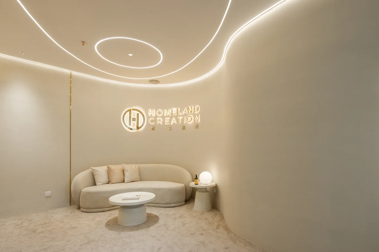 Homeland Creation reception with curved seating and ceiling light