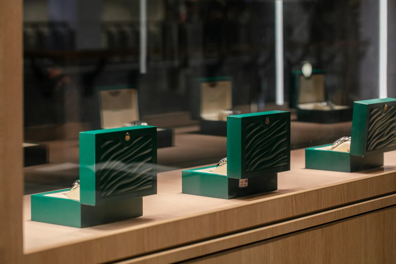 The shallow-focus display supplies a restrained retail texture between room views.