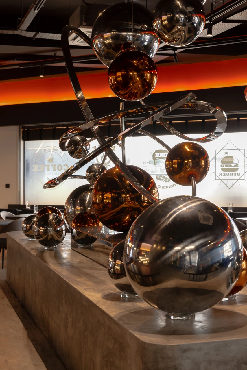 A close view of the suspended spheres records reflection and material depth.